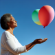 7 Dobrih stvari koje se događaju u životu kada pustite kontrolu | A person releasing a balloon into a clear blue sky, symbolizing freedom and letting go.