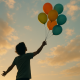 7 Dobrih stvari koje se događaju u životu kada pustite kontrolu | A person releasing balloons into the sky, symbolizing freedom and letting go.