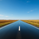 5 Bolno očitih istina o životu koje svi zaboravljaju | A reflective scene of an open road stretching into the horizon under a clear blue sky.